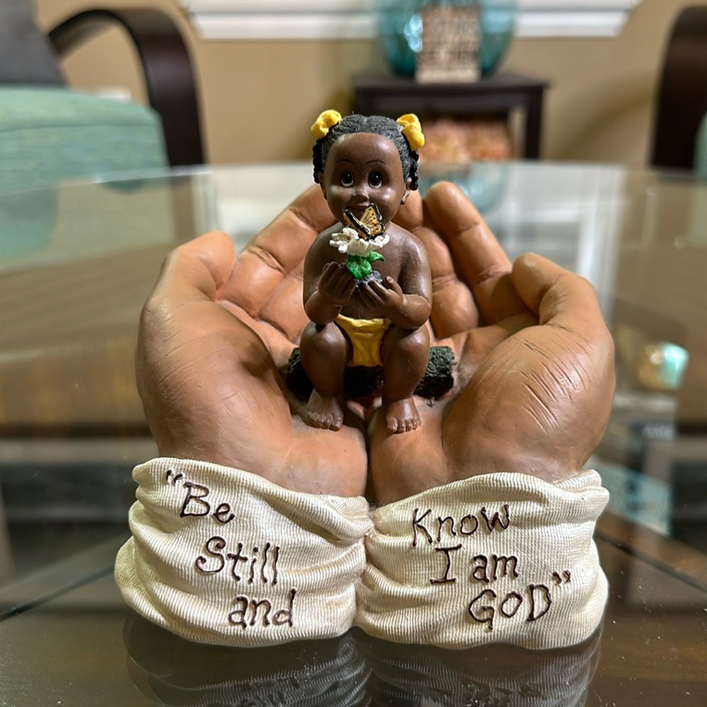 In his hands figurine